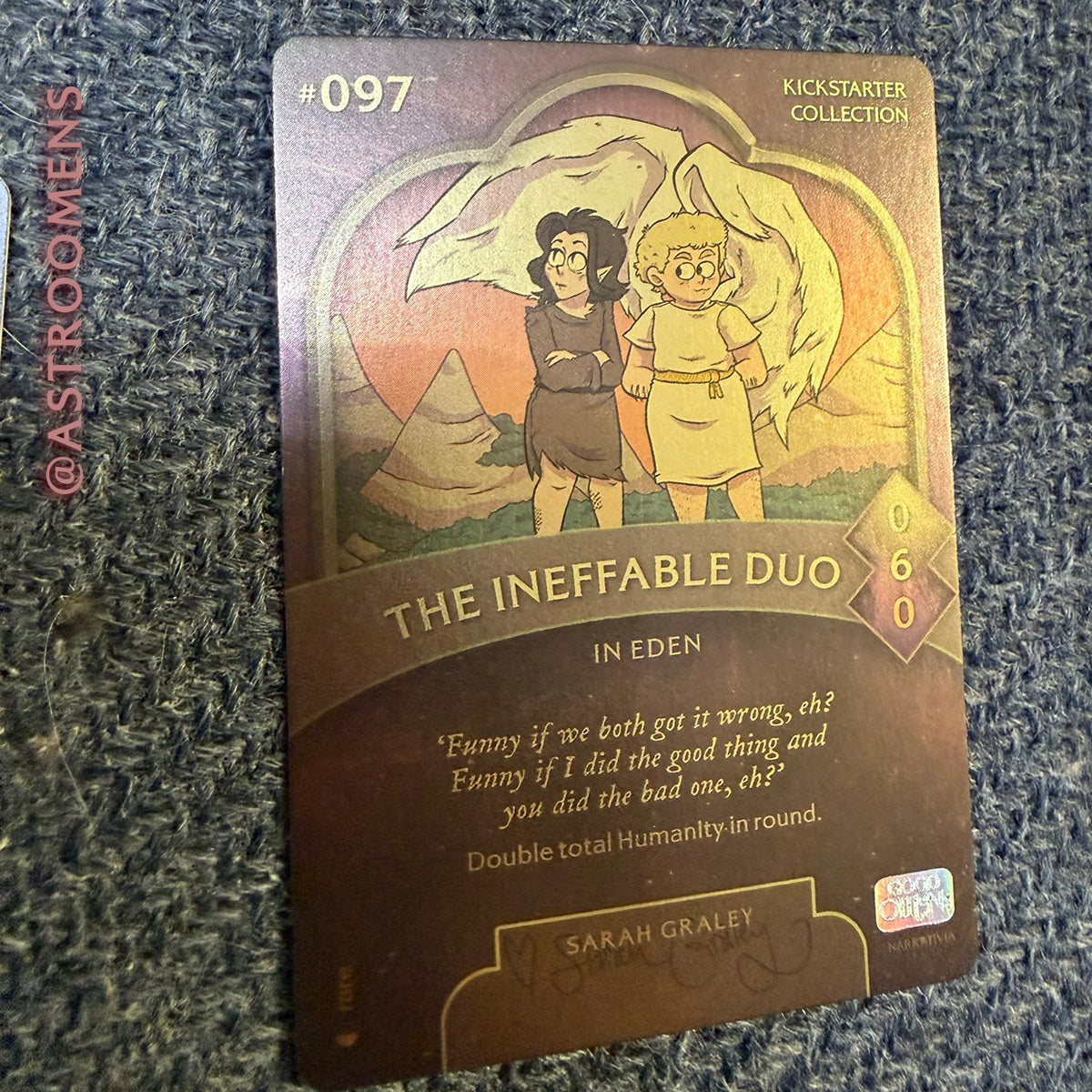 Photo of the trading card 'the Ineffable duo', illustrated by Sarah Graley.