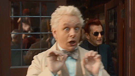 Aziraphale doing jazz hands as he says the word clue.