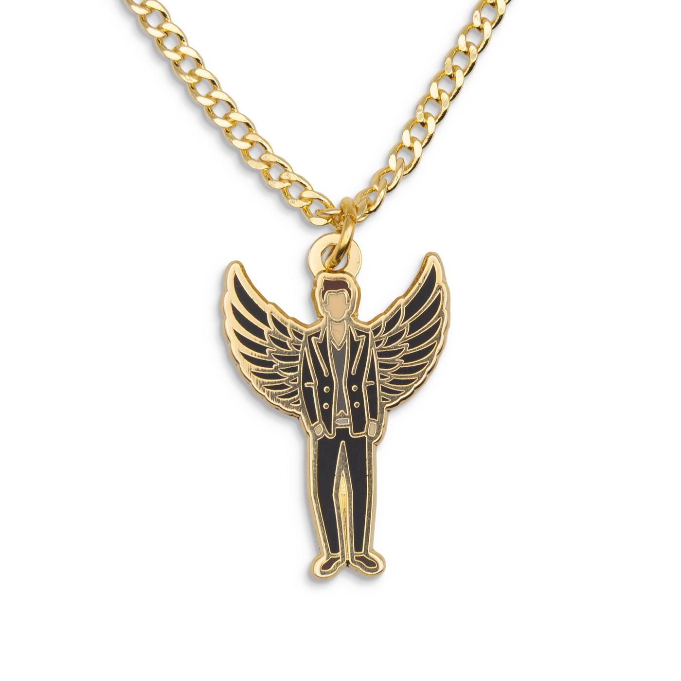 A golden Crowley pendant.