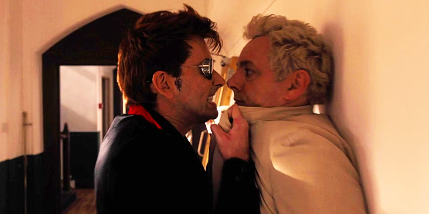 Crowley has Aziraphale pushed against a wall, and they stand nose to nose.