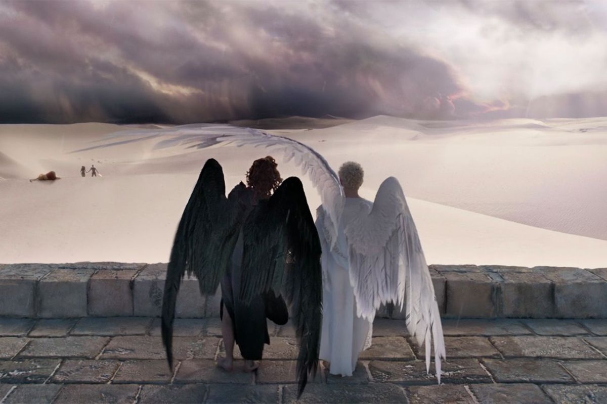Crowley and Aziraphale standing atop the walls of Eden.