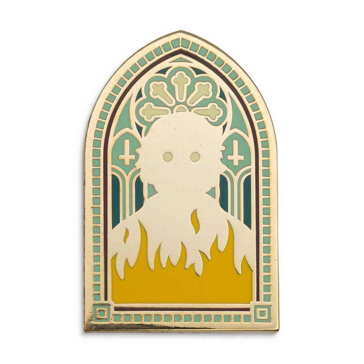 Photograph of a Good Omens enamel pin: the Antichrist.