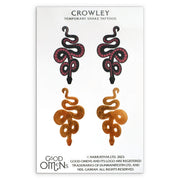 Image of the termpoary tattoo sets, featuring Crowley's serpent-like sideburns.