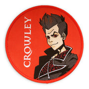 A circular patch featuring an illustration of Crowley in an anime style.